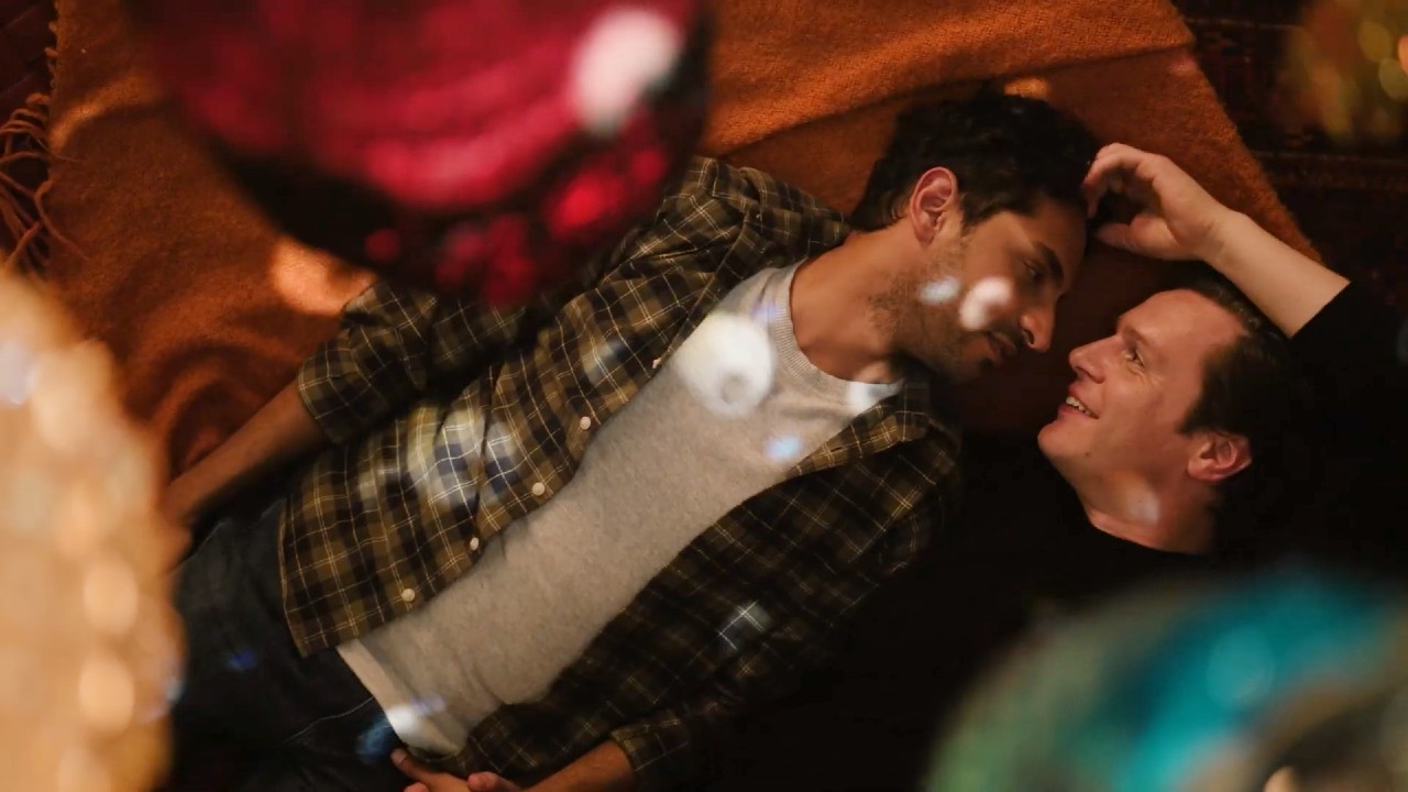 Karan Soni and Jonathan Groff looking at each other in A Nice indian Boy.