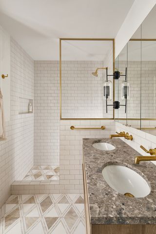 pink diamond tiled bathroom with shower and double sinks