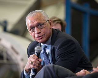 former nasa administrator charles bolden leaning forward with a microphone