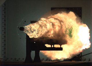 Photo taken from a high-speed video camera during a firing of an electromagnetic rail gun (EMRG) at the Naval Surface Warfare Center in Dahlgren, Virginia, on Jan. 31, 2008.