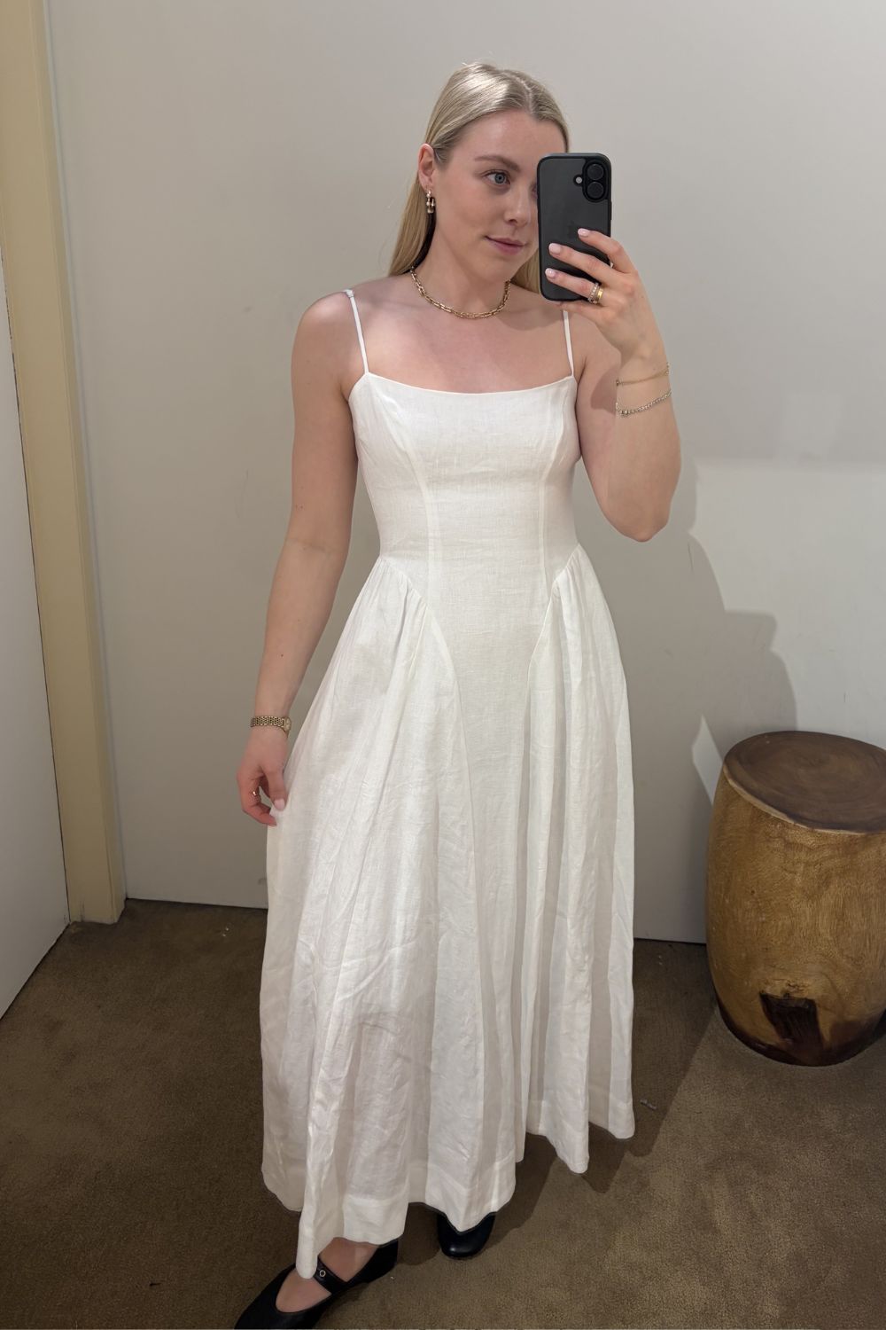 Woman wears white basque waist dress