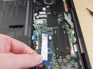 Pull the SSD away from the slot.