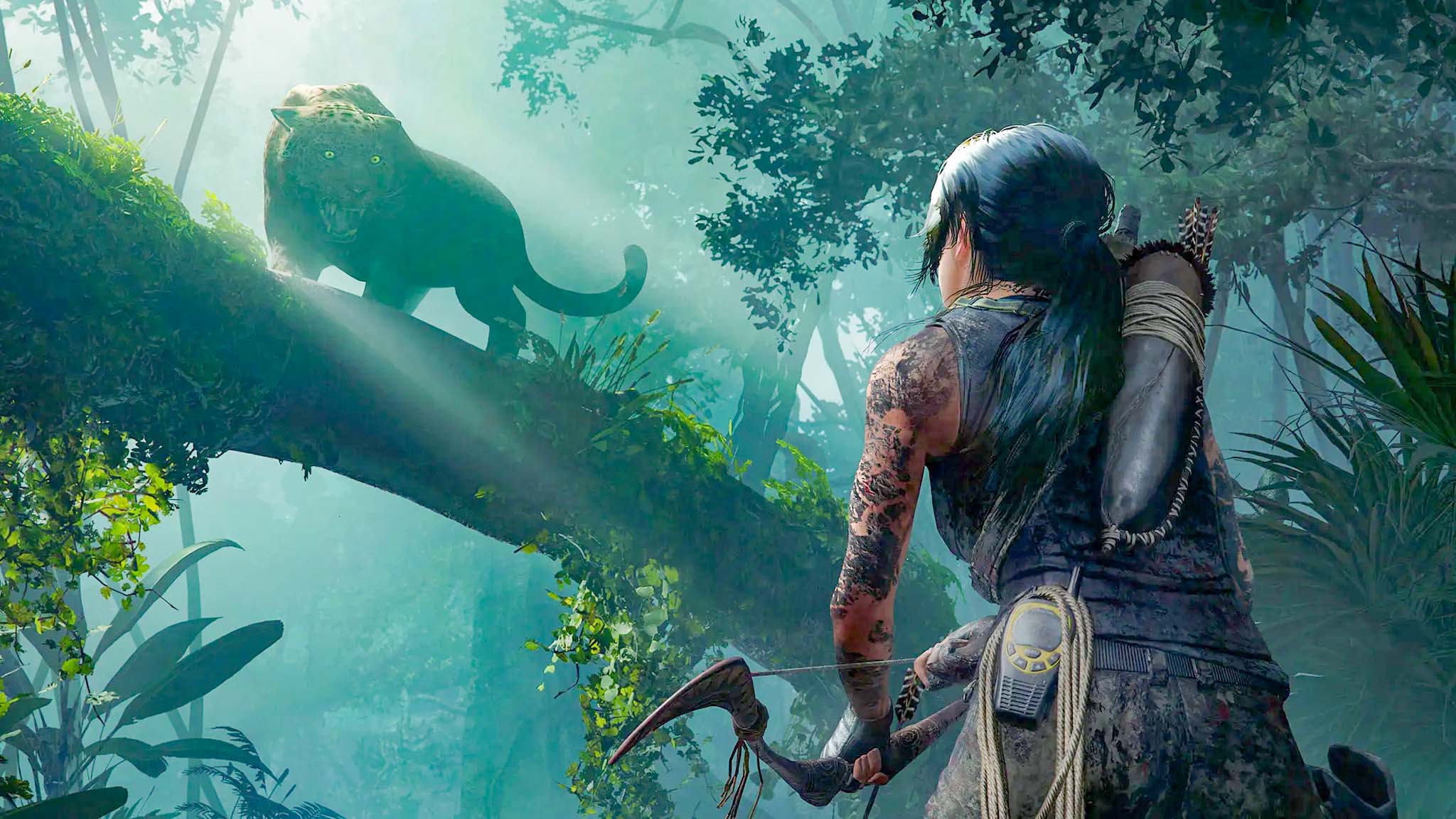 A scene from Shadow of the Tomb Raider showing Laura hunting through a forest with her bow while a leopard prowls a branch above her.