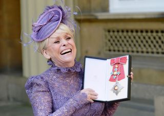 (John Stillwell/PA) Television star Barbara Windsor after she was made a Dame Commander of the order of the British Empire by Queen Elizabeth II during an Investiture ceremony at Buckingham Palace, London.