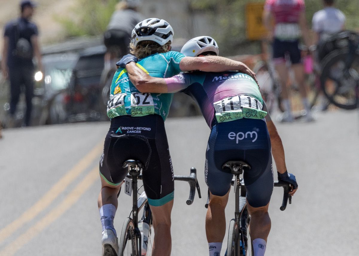A congratulatory hug from the winners of the stage and race