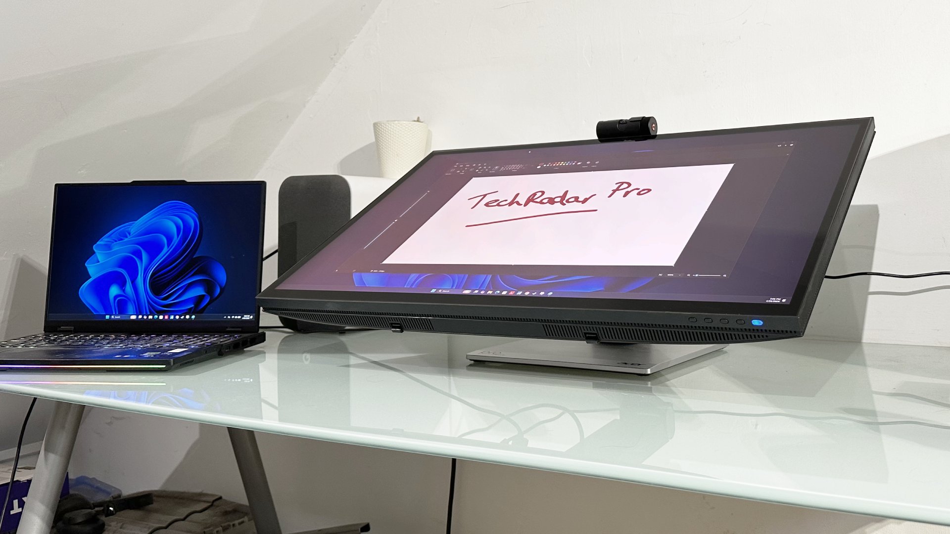 The Acer ProCreator PE320QXT on a desk in a home office during our testing process