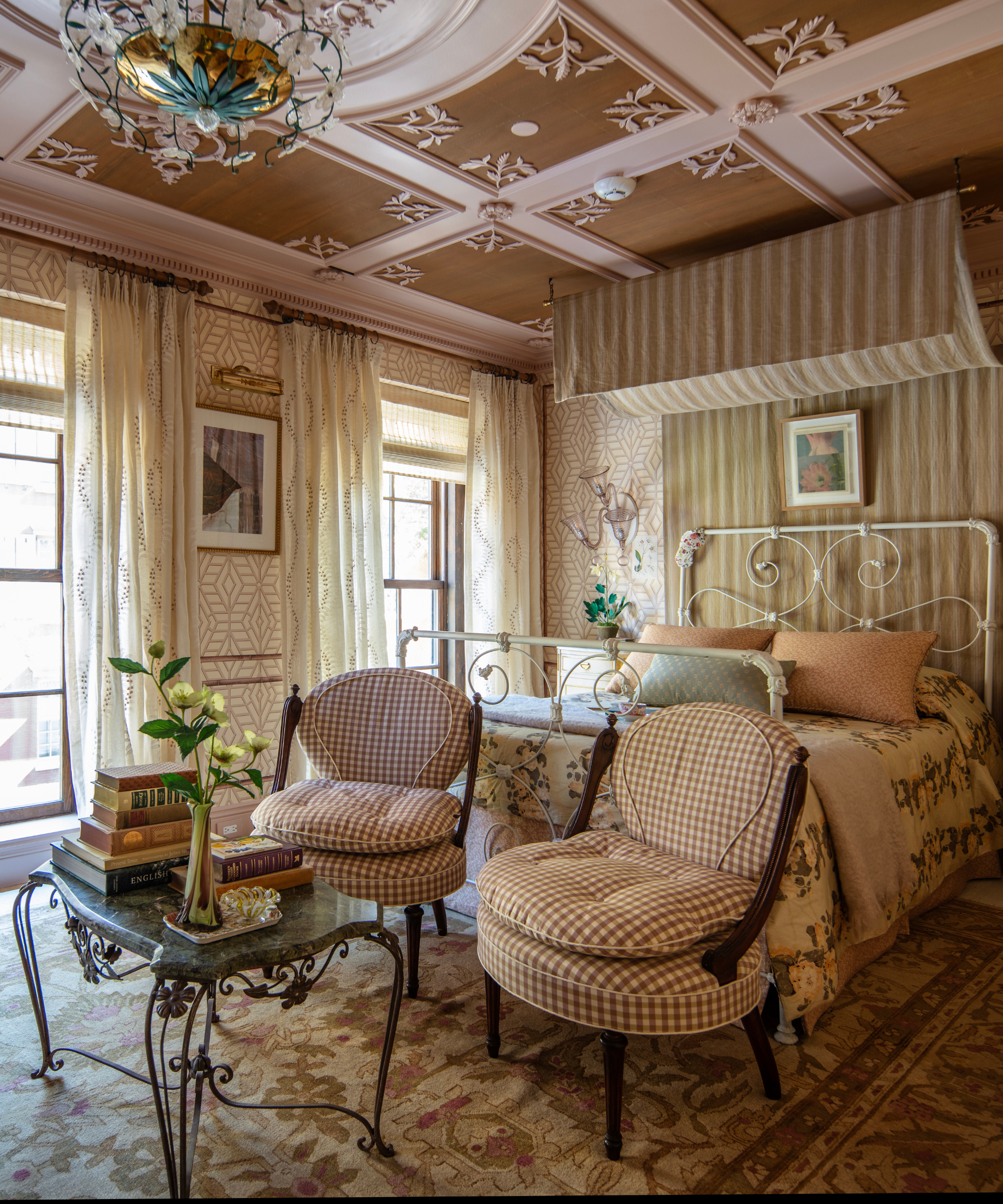 Whimsically feminine bedroom area featuring florals across the rug, bedding, ceiling motifs, and central light fixture.