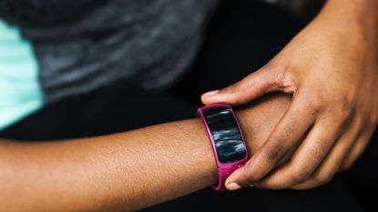 Activity tracker: fitness tracker on woman's arm