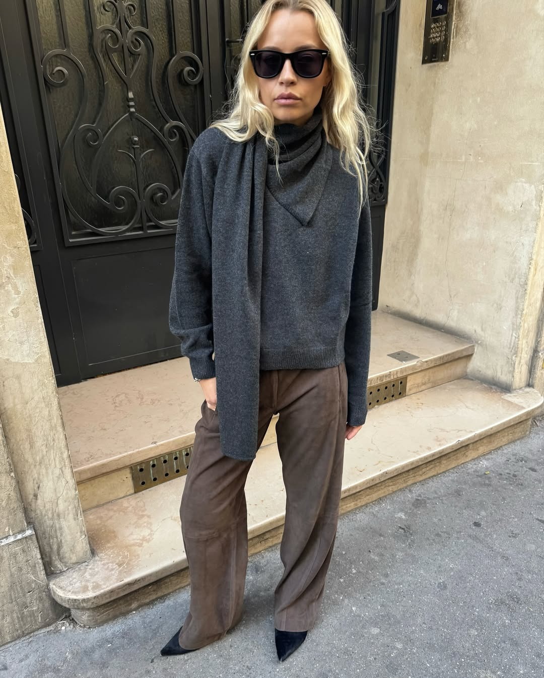 Woman in scarf sweater.