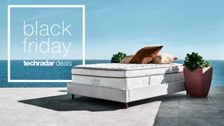 Saatva Classic mattress on a sunny patio with Black Friday deals graphic