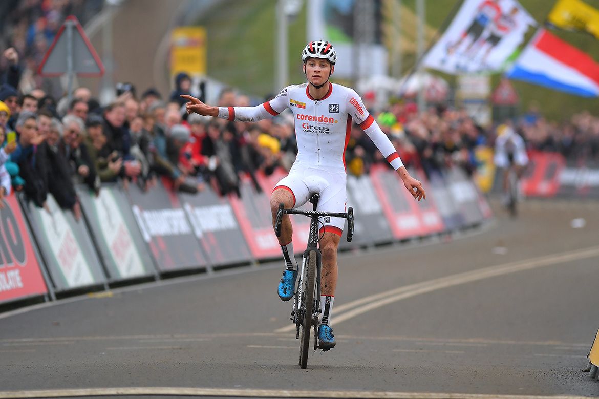 Mathieu van der Poel sits up and celebrates