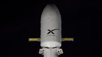 A SpaceX rocket with a Starlink logo on it