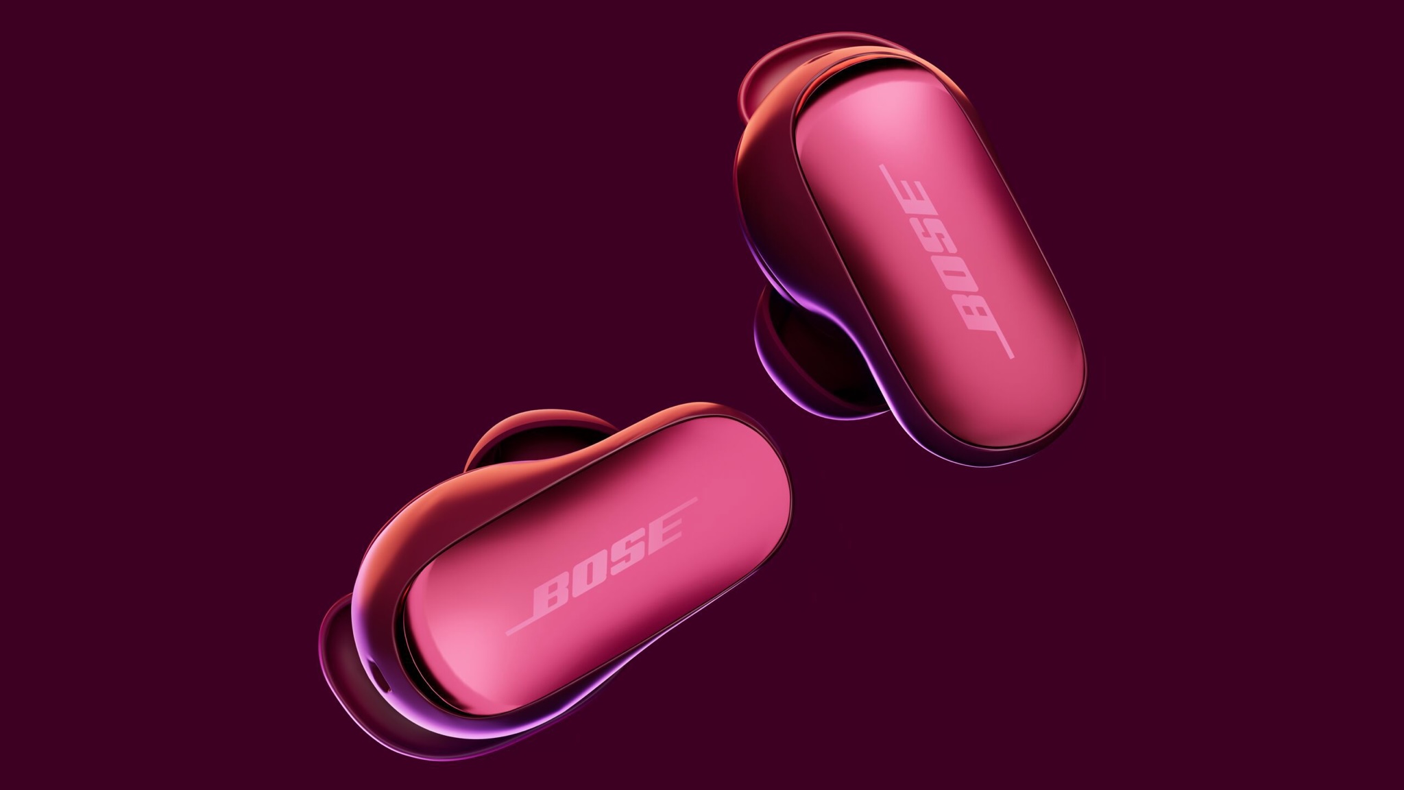 A pair of Bose QuietComfort Ultra Earbuds (2nd Gen) on a dark background.