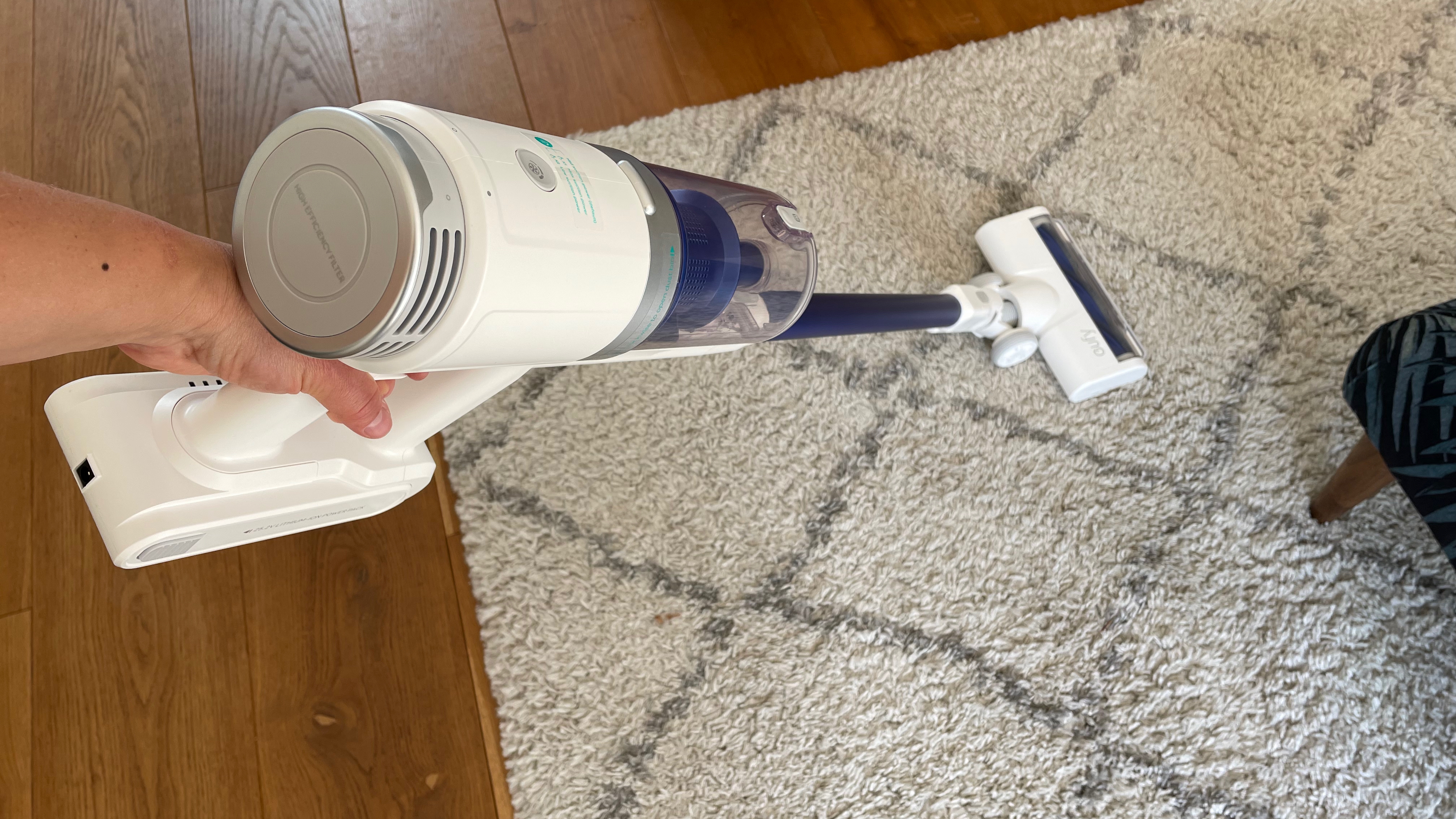 Eufy HomeVac S11 Infinity being used on a thick rug