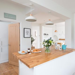 kitchen with wooden flooring and wooden door