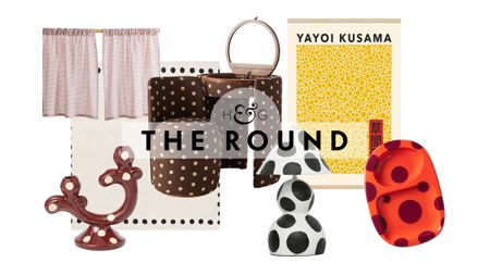 Polka dot decor, including cafe curtains, a candlestick, rug, vanity set, table lamp, wall art, and trinket tray, pictured against a white background