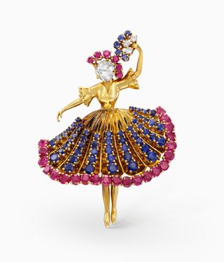 Ballerina in gold with colourful stones on her skirt
