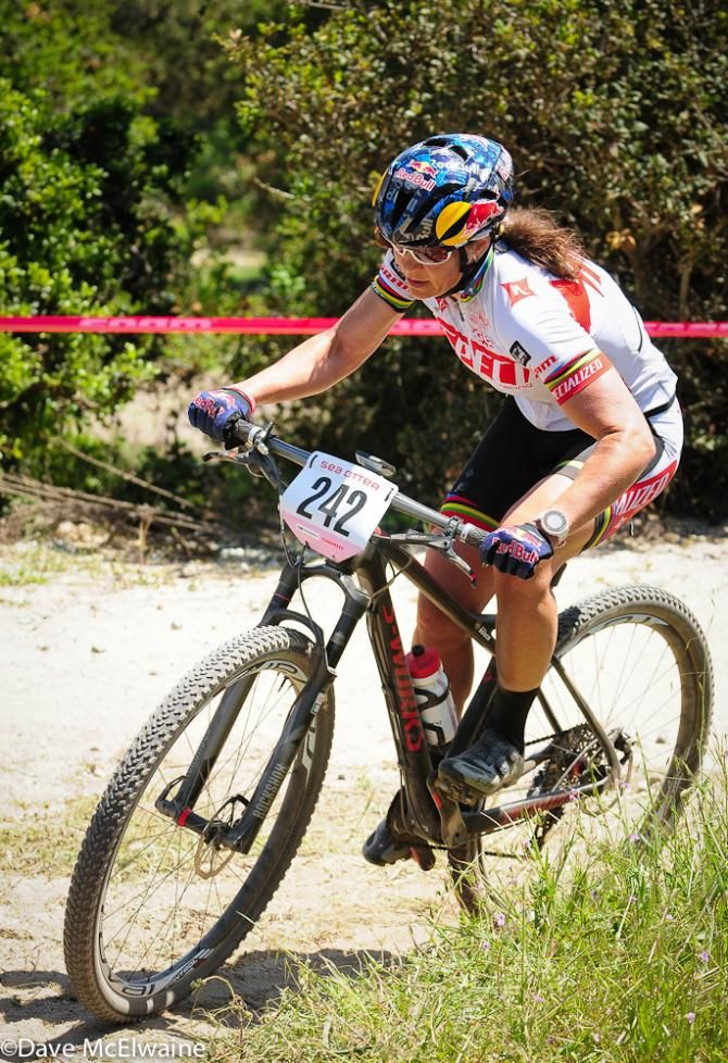 Rebecca Rusch (Specialized) coming over the top of the big climb