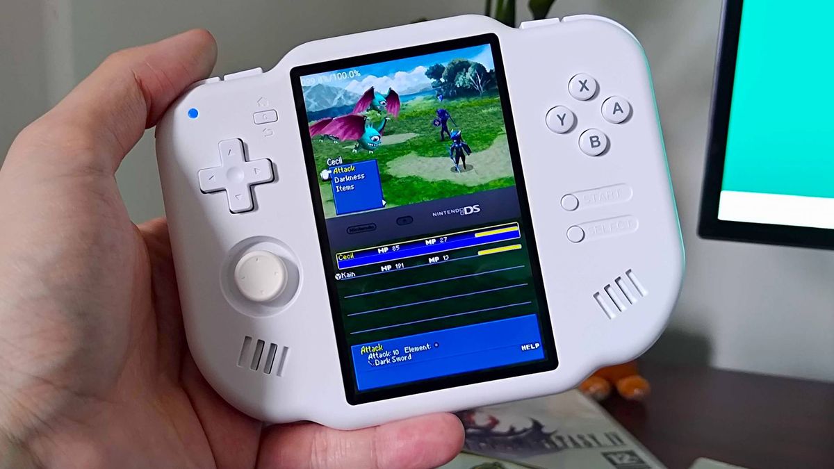 Hand holding MagicX Zero 40 with Final Fantasy 4 battle on screen.