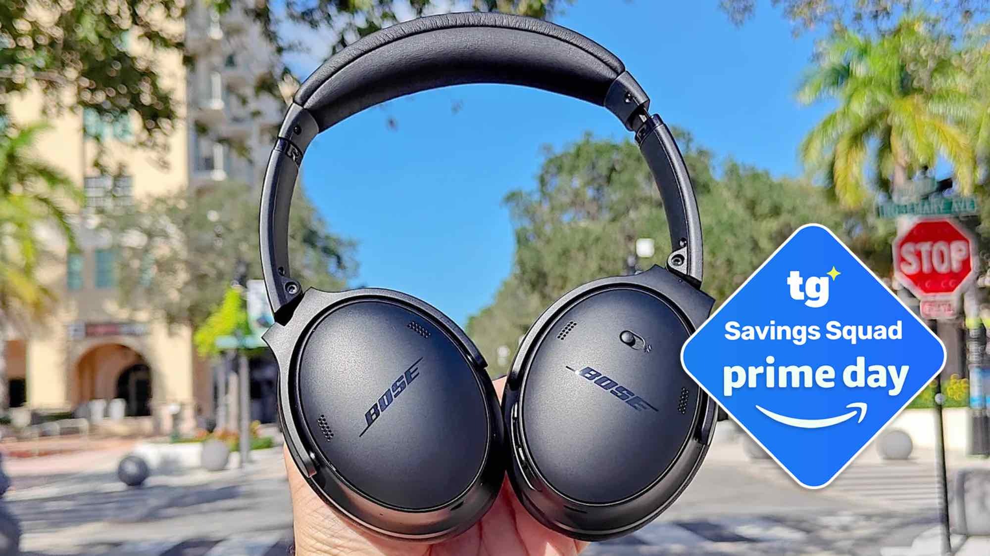 Bose headphones in hand