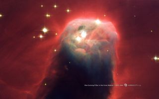 The cone nebula. Radiation from hot stars off the top of the picture illuminates and erodes this giant, gaseous pillar.