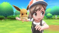 Pokemon Let's Go Eevee screenshot of a trainer sending her partner Eevee into battle.