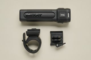 Knog Blinder 1300 front bike light on cream background