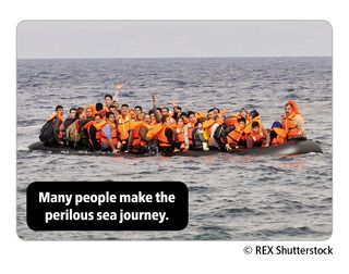 Image of migrants in a boat on the sea