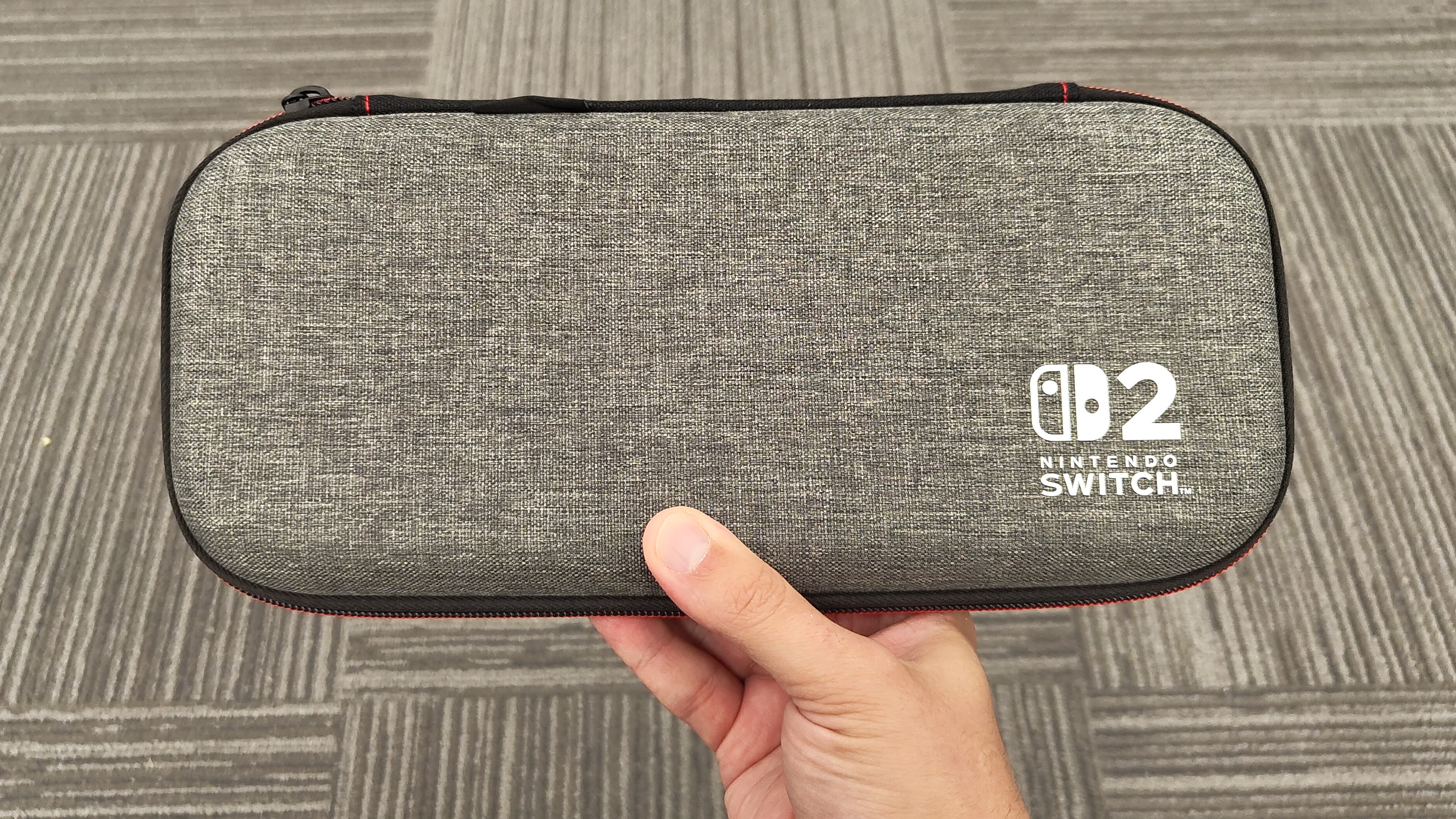 A person holding a Nintendo Switch 2 in a case from PowerA