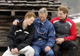 Prince Charles poses with his sons Prince William (R) and Prince Harry (L) during the Royal Family's ski break at Klosters on March 31, 2005 in Switzerland. during a photocall on the Royal Family's ski break in the region at Klosters on March 31, 2005