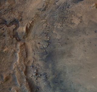 This image shows the remains of an ancient delta in Jezero Crater, which NASA's Perseverance Mars rover will explore for signs of fossilized microbial life. The image was taken by the High Resolution Stereo Camera on ESA's Mars Express orbiter.