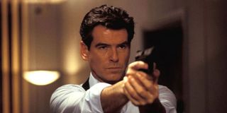 Pierce Brosnan holding gun as James Bond