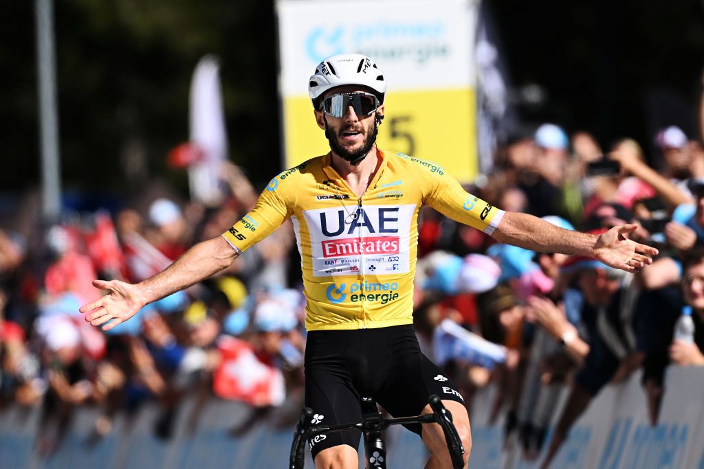 CARI SWITZERLAND JUNE 13 Adam Yates of The United Kingdom and UAE Team Emirates Yellow leader jersey celebrates at finish line as stage winner during the 87th Tour de Suisse 2024 Stage 5 a 1486km stage from Ambri to Cari 1636m UCIWT on June 13 2024 in Cari Switzerland Photo by Tim de WaeleGetty Images
