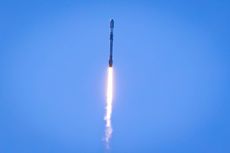 Falcon rocket launching into the sky from SpaceX facility