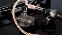 Campfire Audio Chimera wired in-ear headphones on a black surface 