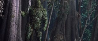 The plant-elemental Swamp Thing looks over his swamp