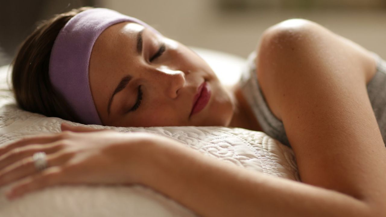 Woman wearing Sleepphones Effortless headphones