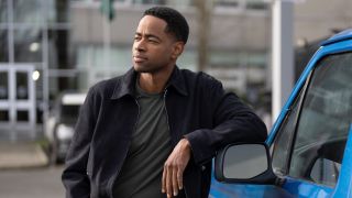Jay Ellis as Alex Holland leaning against a car for The Rookie: North.
