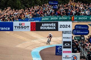 Van der Poel cross the line in Paris-Roubaix 2024
