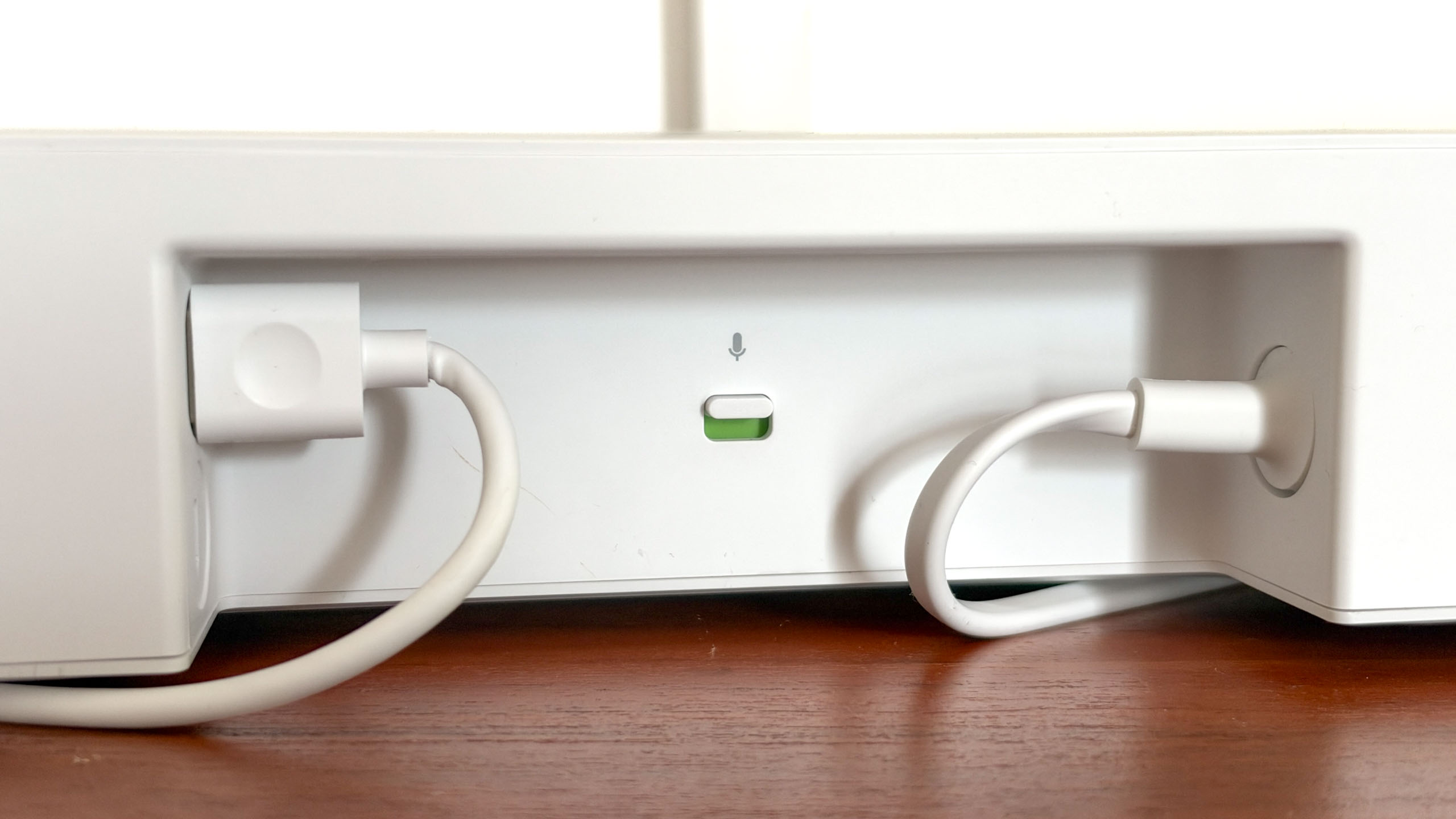 A Sonos Beam Ultra soundbar on a side table