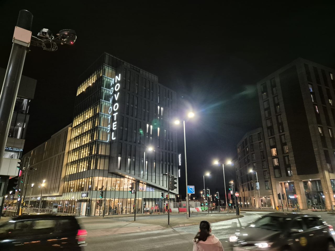 A tall hotel building at night
