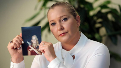 Virginia Roberts Giuffre, with a photo of herself as a teen, when she says she was abused by Jeffrey Epstein, Ghislaine Maxwell and Prince Andrew, among others.
