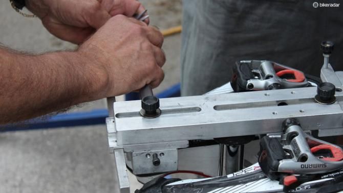 Orica-GreenEdge mechanics have a custom tool for replicating cleat position on multiple pairs of shoes for a rider