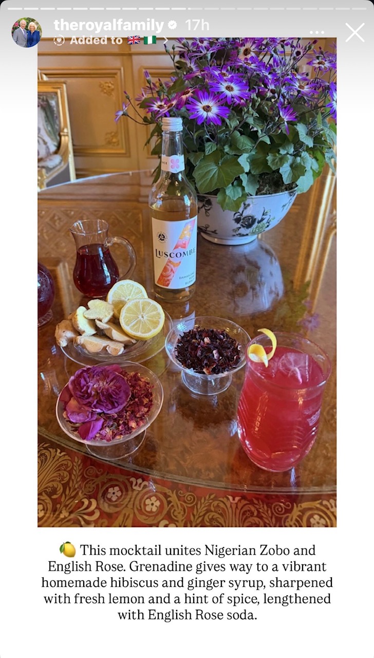 A table with bowls of rose petals and a glass with a red mocktail in it