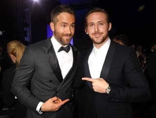 SANTA MONICA, CA - DECEMBER 11: Actors Ryan Reynolds (L) and Ryan Gosling attend The 22nd Annual Critics' Choice Awards at Barker Hangar on December 11, 2016 in Santa Monica, California. (Photo by Jeff Kravitz/FilmMagic)