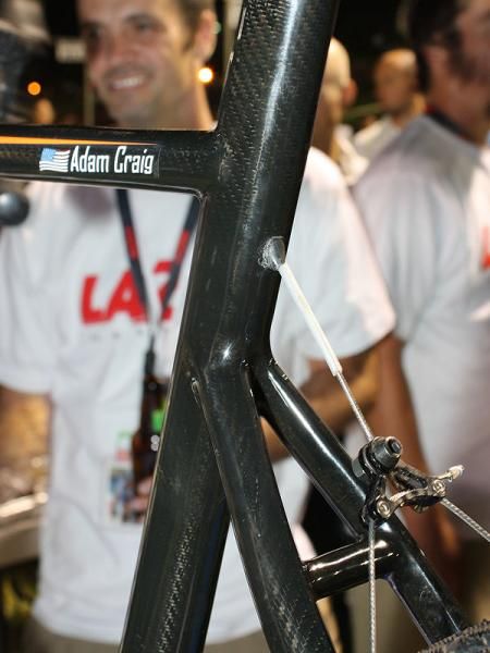 There's presumably an internal guide that helps redirect the cable down around the seat cluster.