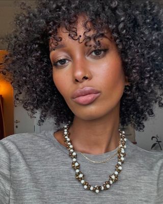 Mona Mali with crown curls