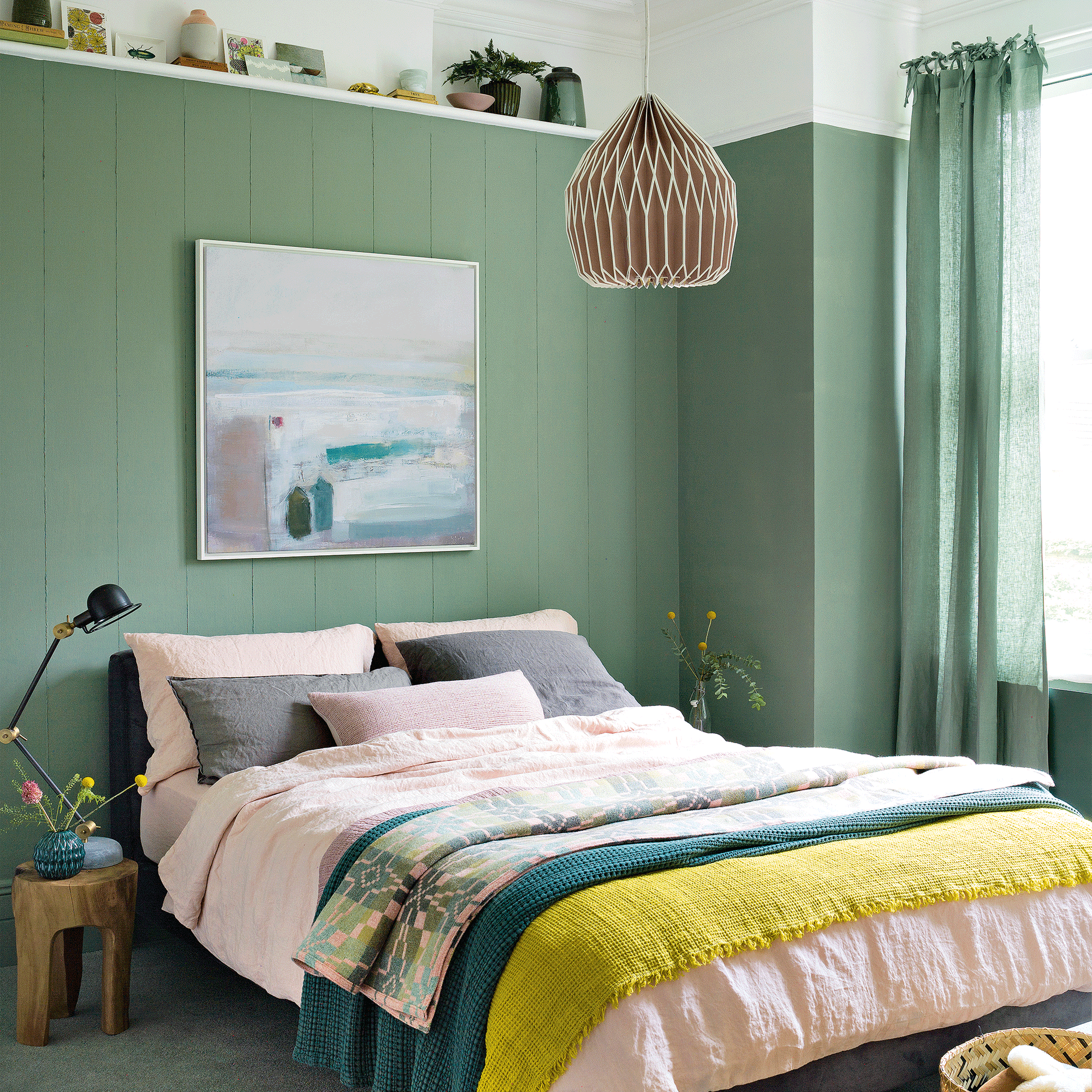 Green bedroom with pendant light