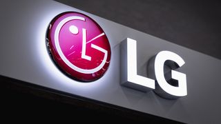 The LG logo glowing on the side of a building