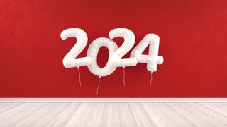 2024 on single white balloons against red wall